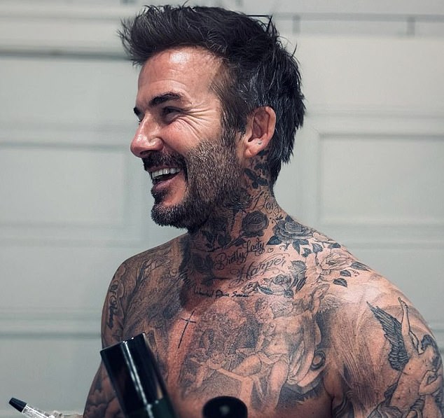 David Beckham shows off his collection of tattoos, built up over the years