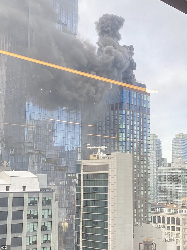 A major fire has broken out on the roof of a skyscraper in Midtown Manhattan, filling the skies above New York City with thick smoke