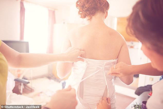 A woman revealed on Mumsnet that she altered a wedding dress for her friend as a favor - but now she's being sued for 'ruining' the dress (stock image)