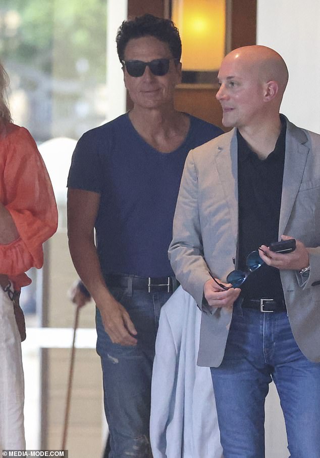 American pop legend Richard Marx (center) was spotted at his hotel in Sydney on Monday