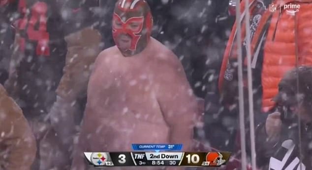 A Cleveland Browns fan took off his shirt early Thursday night despite the snowfall