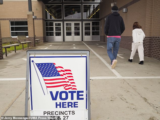 Donald Trump easily won Iowa in Tuesday's presidential election – just as he did in 2016 and 2020. Pictured: Voters arrive to cast their ballots in Sioux City, Iowa on Tuesday, November 5