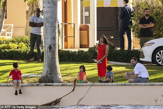 The Vances enjoy family time at Donald Trump's club in Florida. Mum Usha Vance keeps a close eye on Ewan, seven, Vivek, four, and Mirabel, who will celebrate her third birthday next month (left to right)