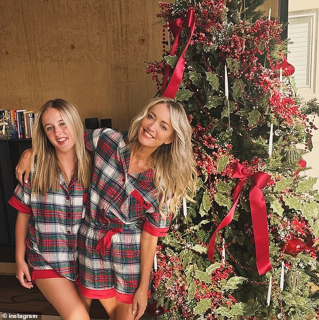 Jackie 'O' Henderson enjoys the finer things in life. And the KISS FM radio star, who makes millions from her top-rated breakfast show, showed off a very expensive Christmas tree on Monday. Pictured with daughter Kitty