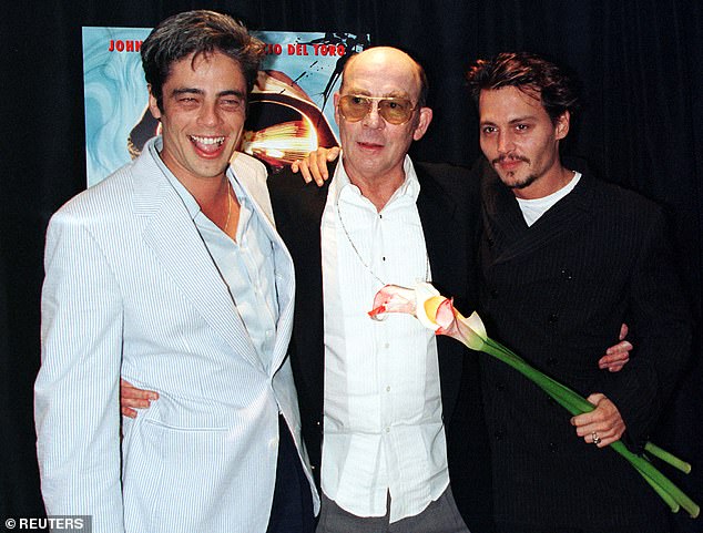 A young Depp began a friendship with the writer in 1994 and would play him in the 1998 film adaptation of his 1972 novel, Fear and Loathing in Las Vegas – pictured in 1998 with Benicio Del Toro