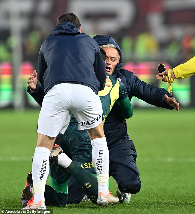 Fenerbahce boss Jose Mourinho stumbled after attempting a knee slide on Sunday evening