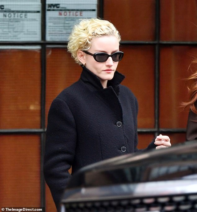 Julia Garner looked stony-faced as she emerged from a Manhattan hotel on Wednesday