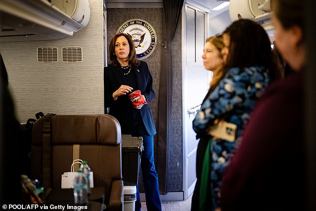 U.S. Vice President and Democratic presidential candidate Kamala Harris eats Doritos and thanks senior personnel aboard Air Force Two