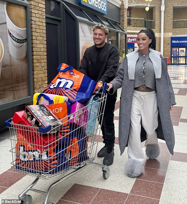 Katie Price looked in good spirits after doing a big shopping at B&M in Burgess Hill, Sussex, with boyfriend JJ Slater on Monday