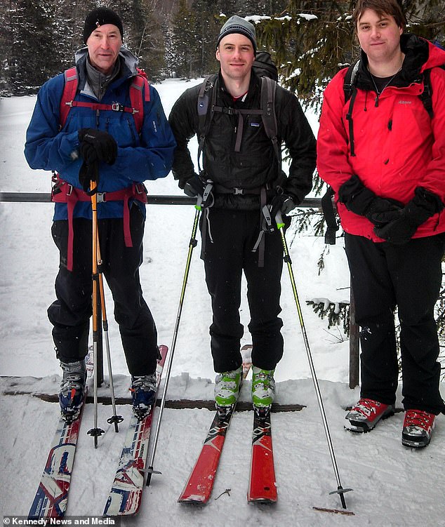 David, pictured with his sons Jared and Dallon, was shocked to learn he had unknowingly broken his back 40 years ago, probably on one of his adventure ski holidays.