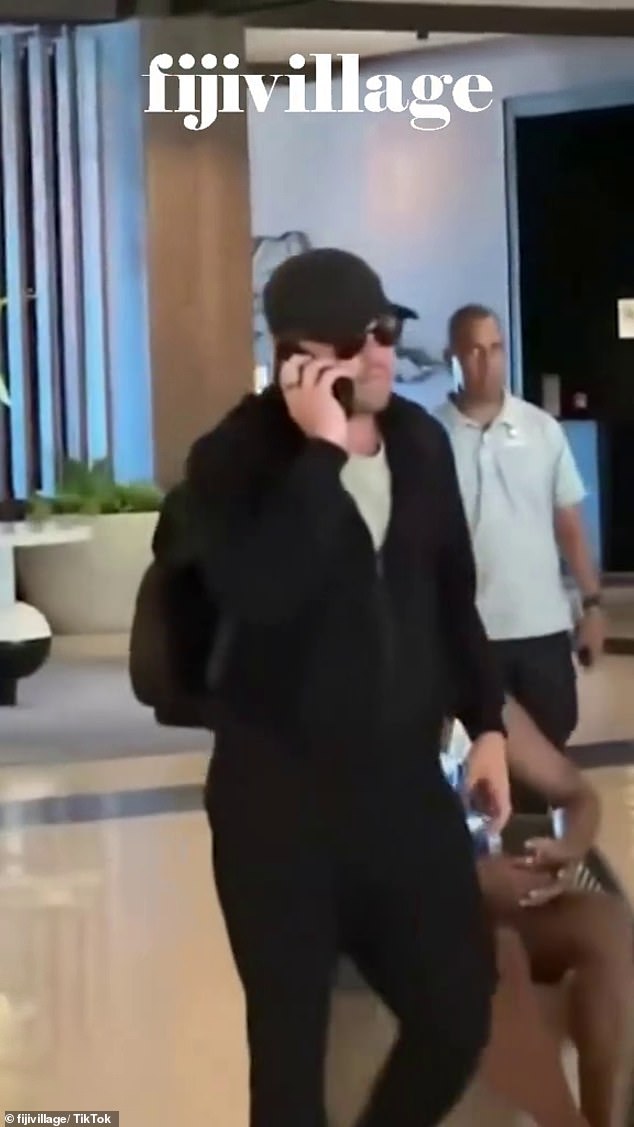 In a video on TikTok, the actor, 50, was seen leaving the hotel as staff lined up to perform an upbeat farewell serenade