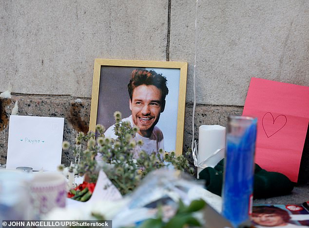 Fans mourned the loss of Liam Payne at a memorial with flowers, candles, photos and handwritten notes in Washington Square Park