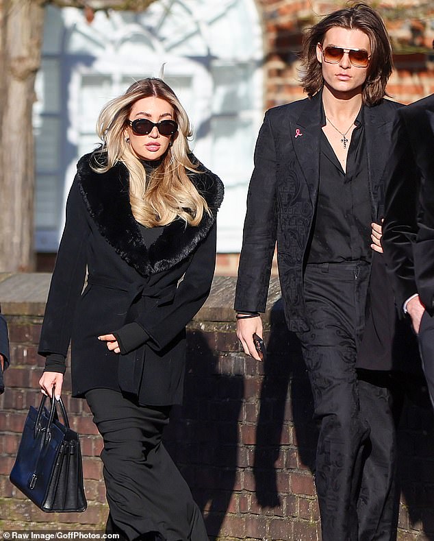 Payne's girlfriend Kate Cassidy, 25, arrives at the church today for the singer's funeral, along with Damian Hurley, 22