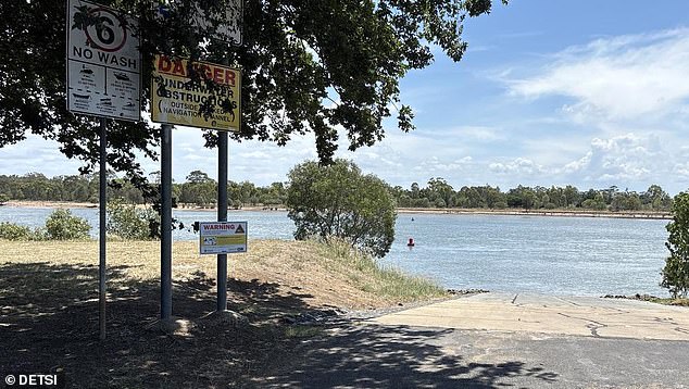 New warning signs have been installed at the site of the crocodile sighting on the Burnett River