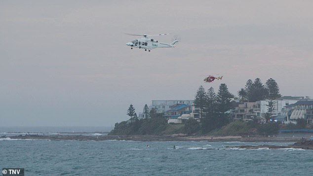 A major search and rescue operation for an 11-year-old boy will resume on Monday morning after he was swept out to sea. Rescue helicopters can be seen in the photo