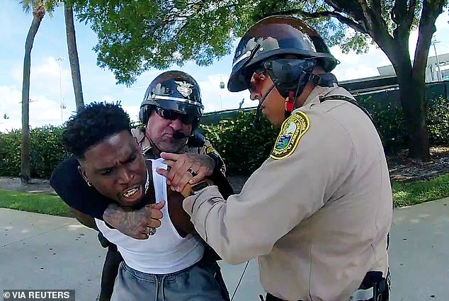 Dolphins star Tyreek Hill was dragged from his car and placed in handcuffs in September