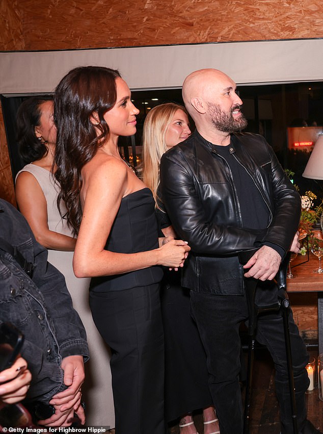 New photos from the glamorous night out show Meghan dancing with her friends to a gospel choir in her strapless black ensemble