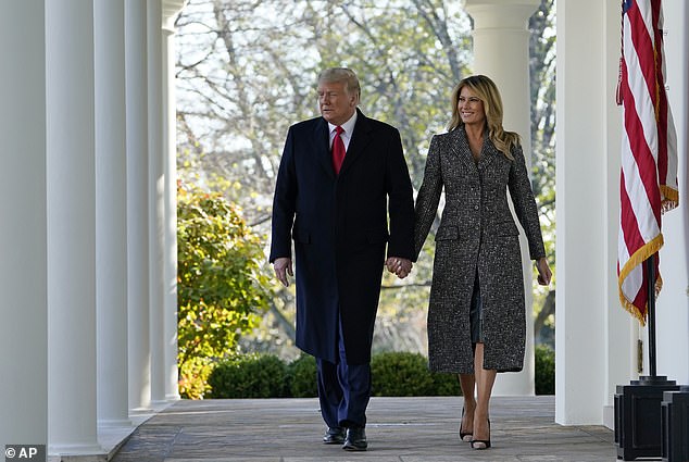 President Donald Trump and first lady Melania Trump walk out of the Oval Office and towards the White House Rose Garden in November 2020