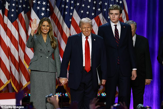 Melania Trump stands alongside Donald Trump and Barron Trump as he takes the stage in Florida to hail his election victory