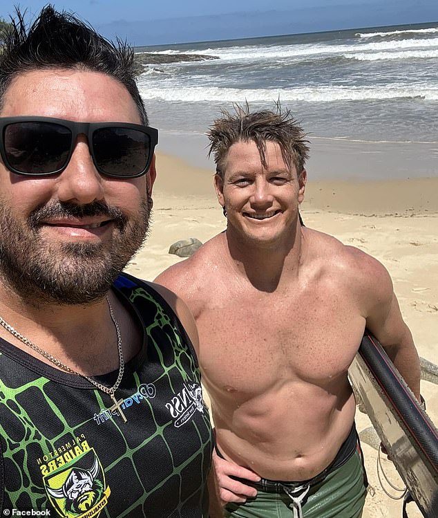 Footy star Harry Grant (pictured right) is being hailed a hero after helping two swimmers struggling near some rocks on a Queensland beach on Wednesday