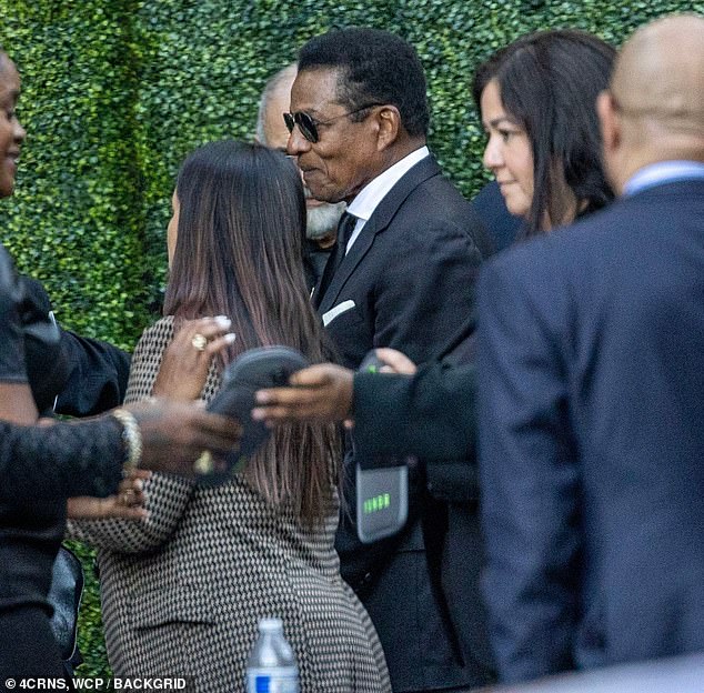 Jermaine also wore black sunglasses when he showed up at the service