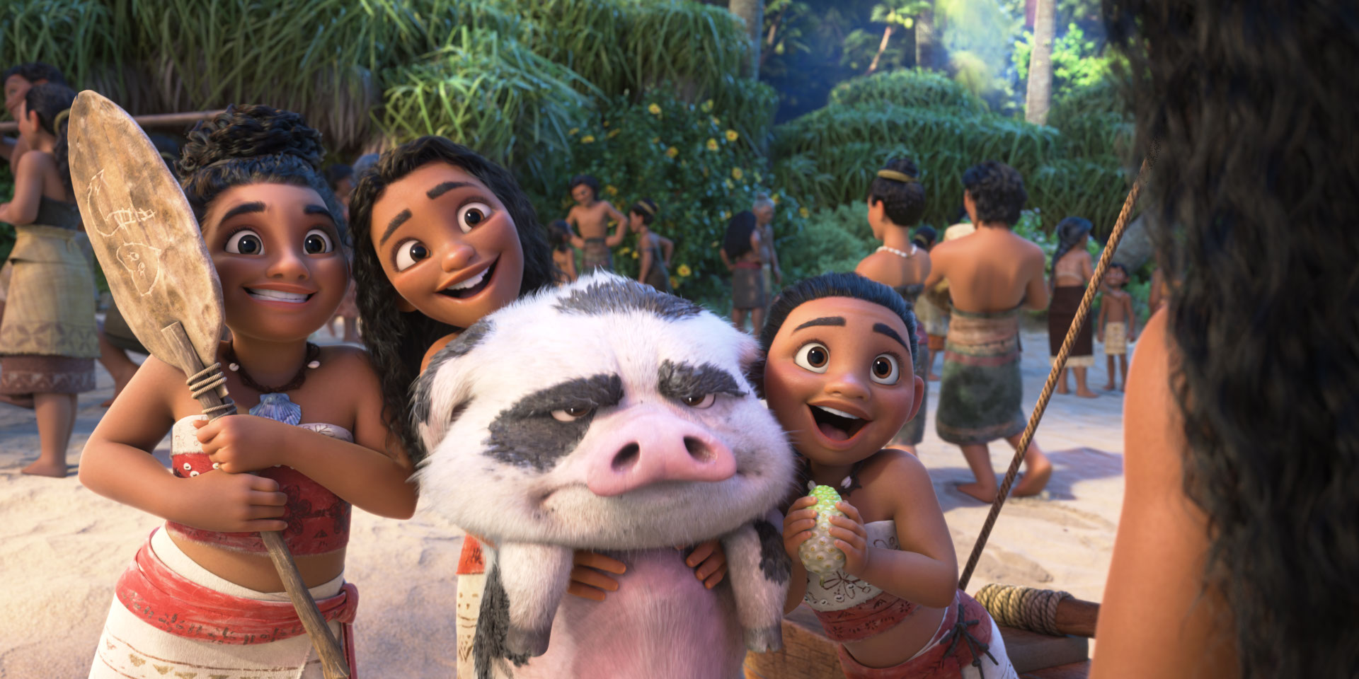 Three young girls from Moana's tribe stand over her while squeezing a pig in Moana 2