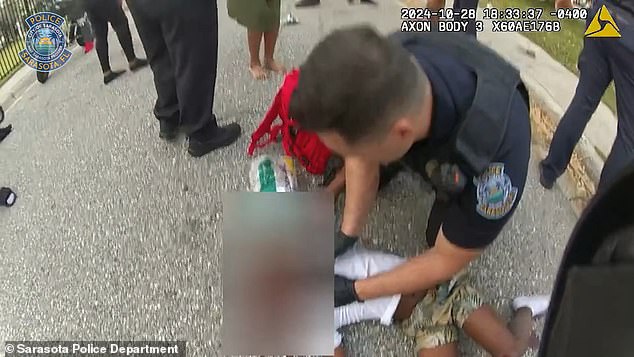 Shocking body camera footage showed a Sarasota police officer performing life-saving measures on 8-year-old Gerard Butler after another officer hit him with a police car