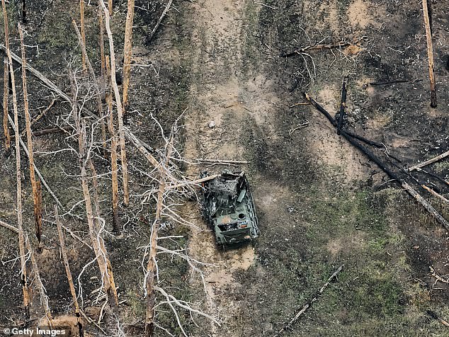 A view from a drone showing a destroyed Russian armored vehicle in part of a forest where the hottest phase of the war is taking place on November 9, 2024. The forest is located about 8 kilometers southwest of Kreminna in Luhansk Oblast, Ukraine