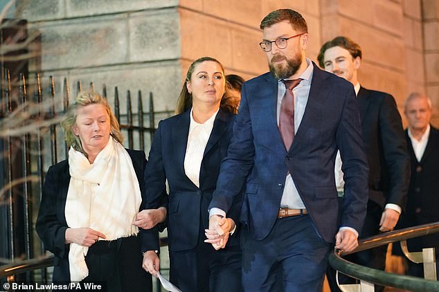 Nikita Hand (centre), also known as Nikita Ni Laimhin, leaves the High Court in Dublin following the personal injury case against Conor McGregor