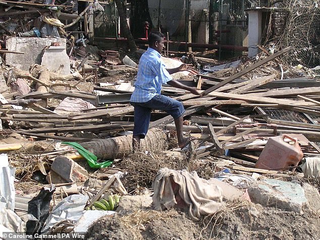 A man observes the rubble in Galle, southern Sri Lanka, after the tsunami swept through the small island country, Thailand and Indonesia