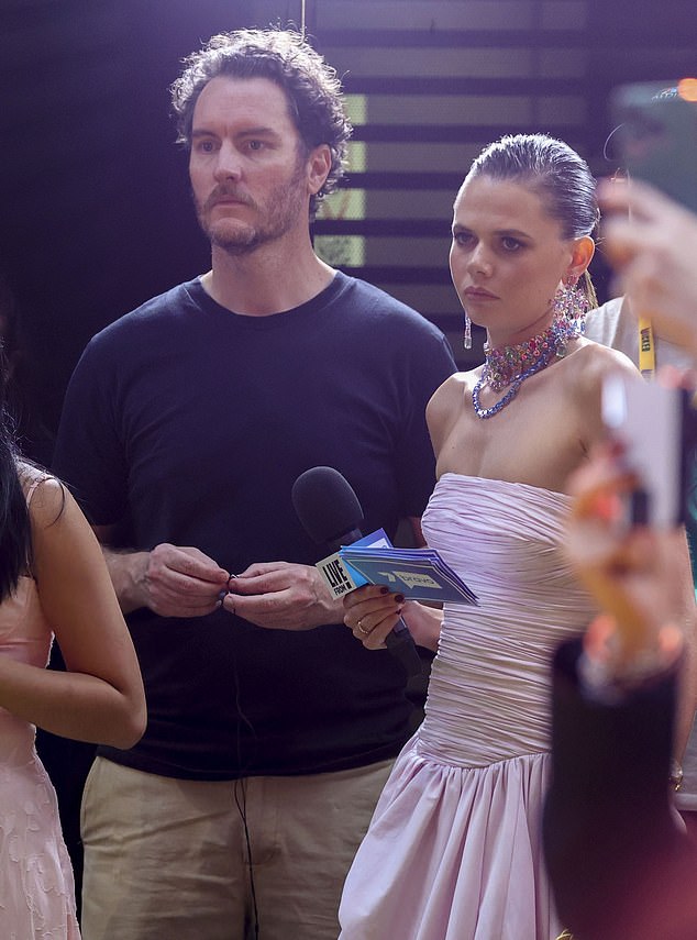 Lucia looked very unimpressed as the singer passed her and signed autographs to fans, while the journalist stood watching her from the crowded media pit.