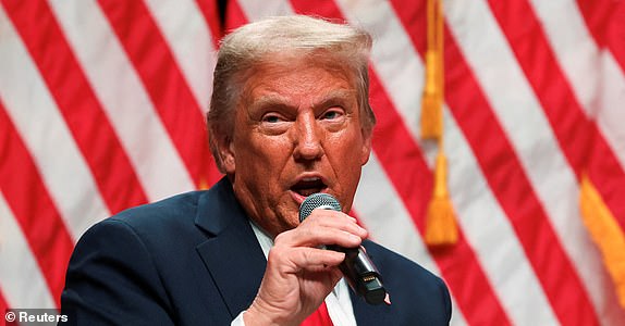 Republican presidential candidate and former US President Donald Trump participates in a fireside chat with Tucker Carlson during 'Tucker Carlson Live on Tour' at the Desert Diamond Arena, in Glendale, Arizona, US, October 31, 2024. REUTERS/Brendan McDermid