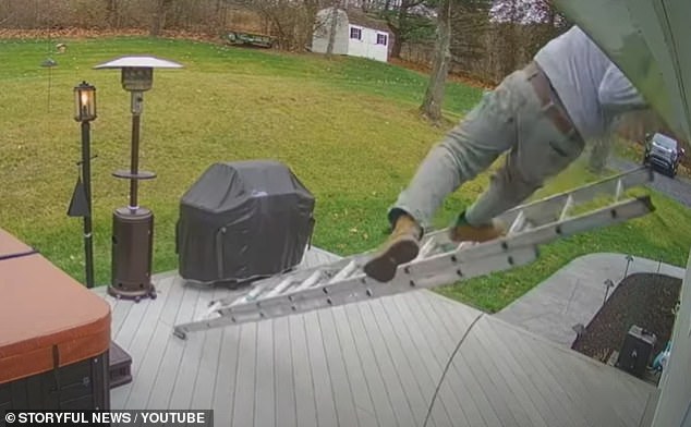 Outdoor security cameras captured the painful moment a ladder slipped from under a man as he decorated his New York home for Christmas