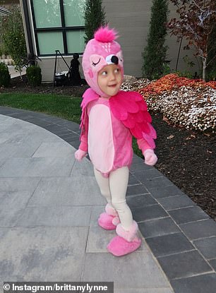 Sterling, three, was all smiles as she got ready to go trick or treating in her pink flamingo costume