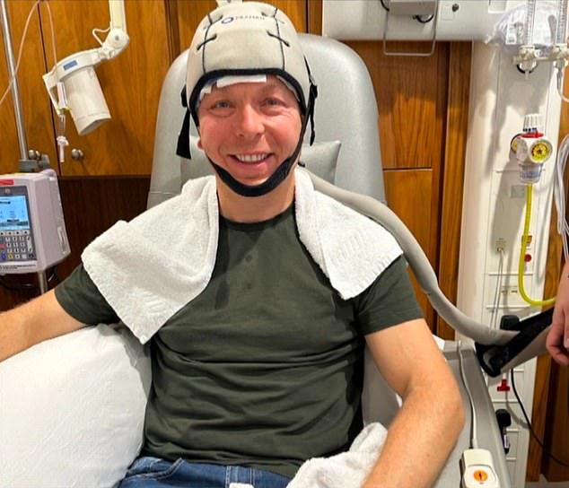 Sir Chris Hoy is pictured wearing a cold cap designed to prevent hair loss during chemotherapy