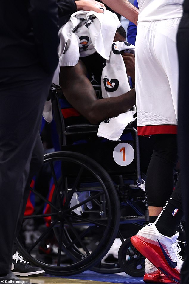 Pistons star Tim Hardaway Jr. was taken off the field in a wheelchair after a collision with Tyler Herro