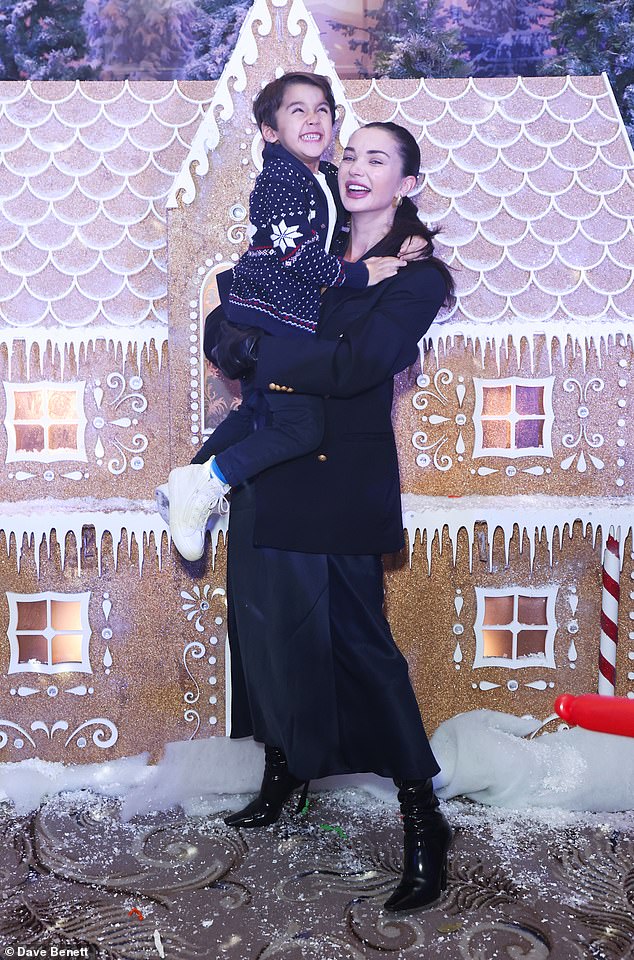 Pregnant Amy Jackson, 32, attended The Caring Family Foundation Festive Wonderland with look-alike son Andreas, five, at the Dorchester Hotel in London on Sunday