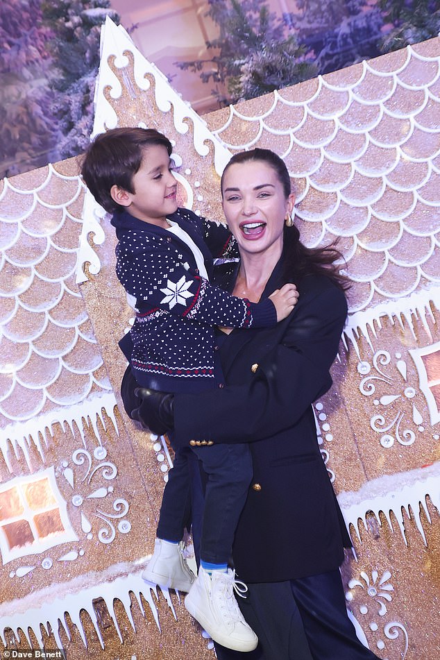 The pair giggled as they walked around a huge gingerbread house at the event which raised money for the Food From The Heart campaign.