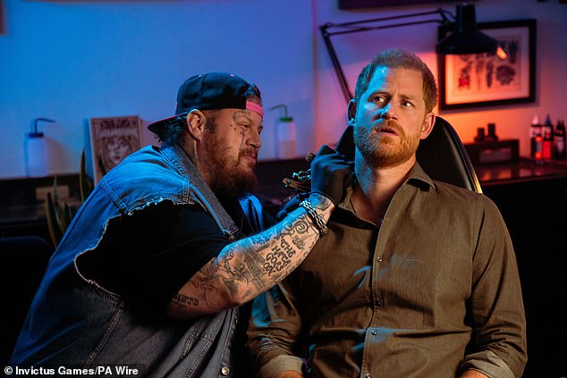 The light-hearted clip is said to have been produced in September and opens with Prince Harry joined by country superstar Jelly Roll at the Lower East Side tattoo parlour.