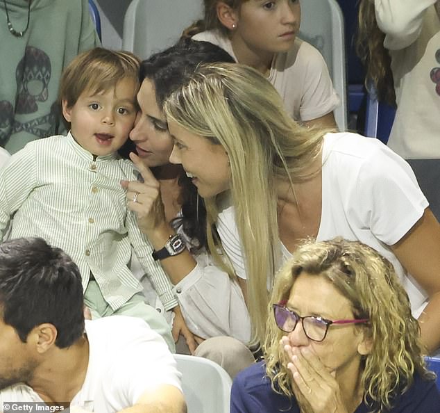 The toddler seemed happy to cheer his father on; the youngster has become a regular at Nadal's close home matches in recent months