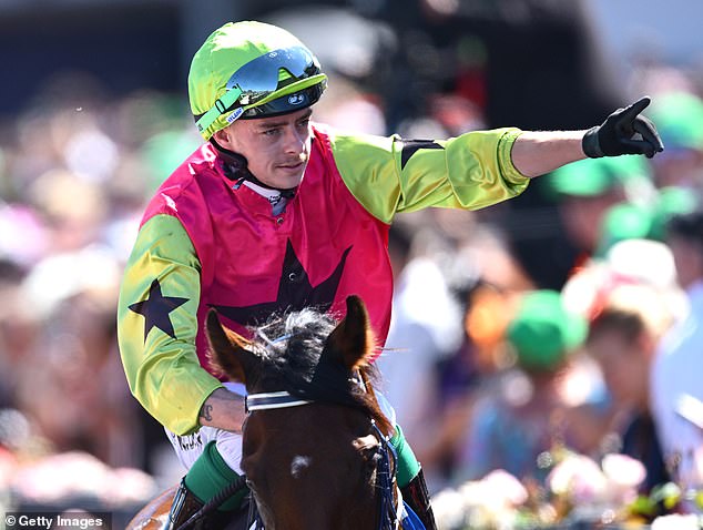 Jockey Robbie Dolan greets the crowd after winning the 2024 Melbourne Cup with Knight's Choice, ahead of Warp Speed ​​​​and Okita Soushi