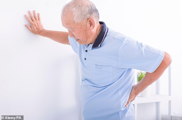 Older people with financial burdens are more likely to suffer from back pain, a study shows (file photo)