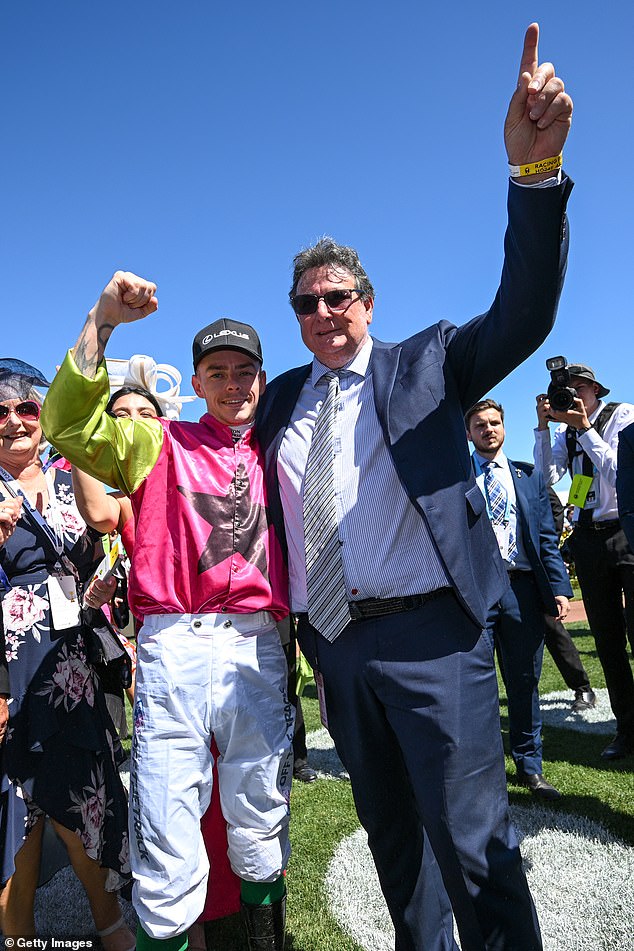 Melbourne Cup-winning co-trainer John Symons (right) has revealed how a concerned friend saved his life after urging him to go to hospital in 2019 to treat crippling back pain