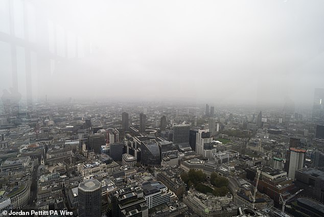 The sky is turning grey, caused by high pressure over Britain trapping moisture on the Earth's surface, creating persistent cloud cover or, in weather terminology, 'anticyclonic gloom'. Pictured is the effect seen from Horizon 22 in Bishopsgate, London, November 8, 2024