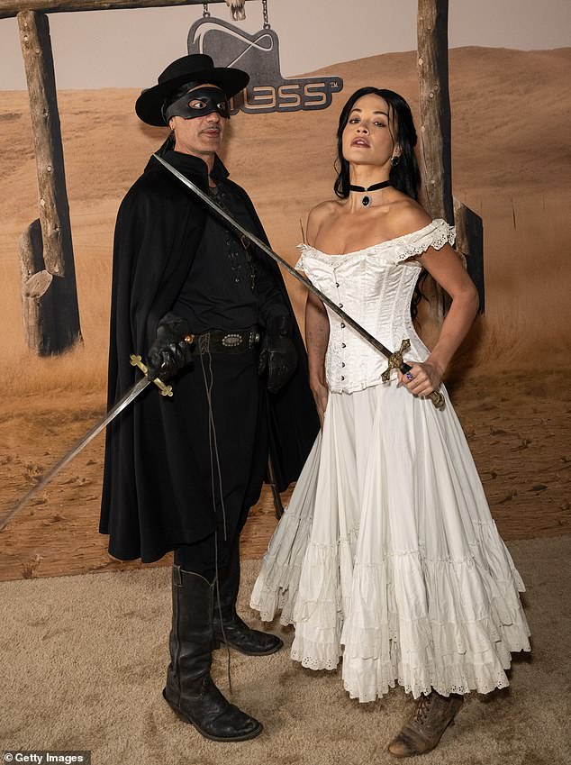 Rita Ora and Taika Waititi did their best impressions of the action movies' Elena Montero and Zorro when they attended Vas J Morgan and Michael Braun's Halloween party in West Hollywood on Thursday night.