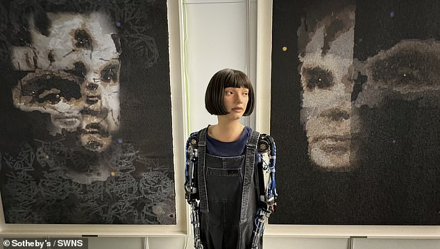 Ai-Da pictured with the artwork at the UN. her AI God portrait was auctioned by Sotheby's to an unknown buyer for $1.32 million