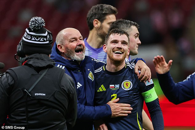 Steve Clarke celebrates with skipper Andy Robertson after Scotland clinched a play-off spot