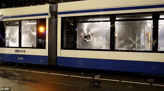 The tram in Amsterdam that was damaged after people armed with sticks and fireworks set it on fire