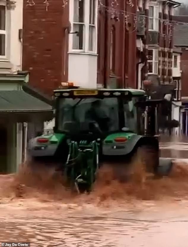 A tractor driver sent a 'wave of water' through the windows of shops today