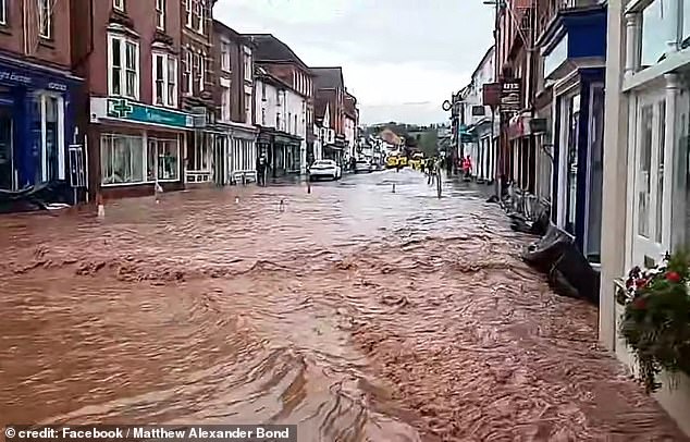 The center of Tenbury Wells, Worcestershire, was seen underwater after the nearby Kyre Brook filled up and broke a wall